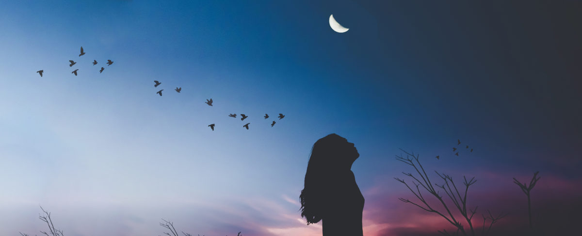 Girl looking at moon